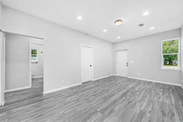 spare room with light hardwood / wood-style floors