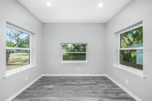 spare room with dark hardwood / wood-style flooring