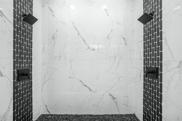 bathroom with a tile shower