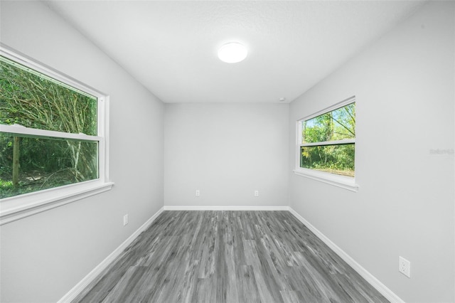 spare room with hardwood / wood-style floors