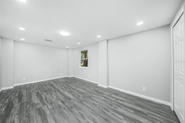 unfurnished room featuring dark hardwood / wood-style floors