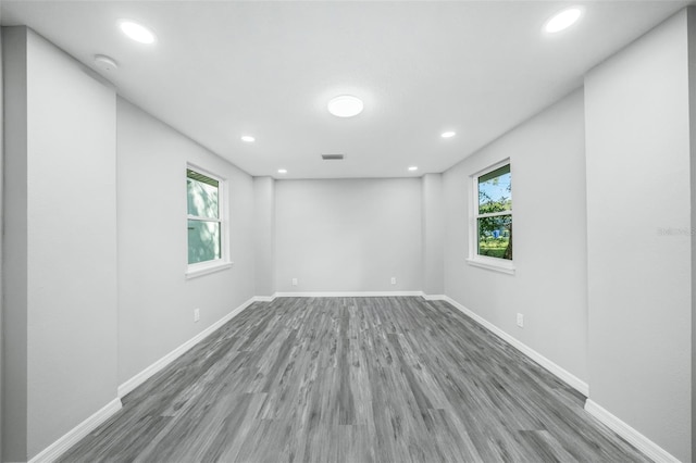 spare room with hardwood / wood-style floors