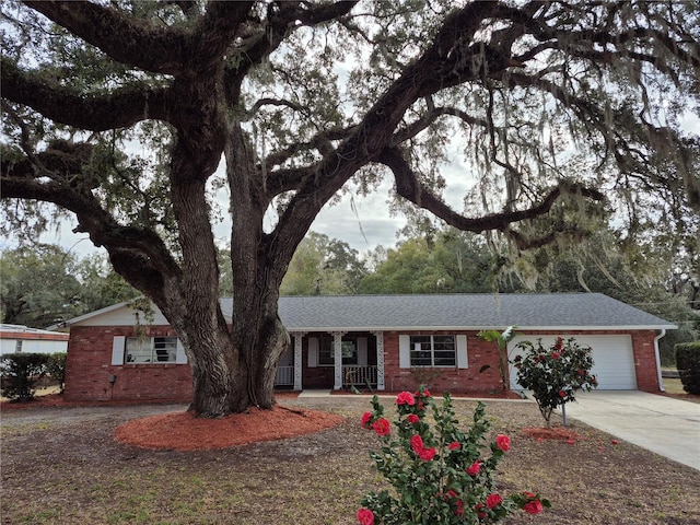 ranch-style home featuring a garage and a porch