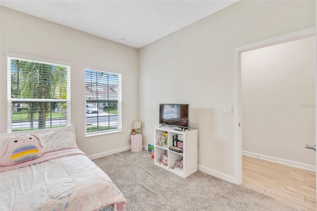 bedroom with light carpet