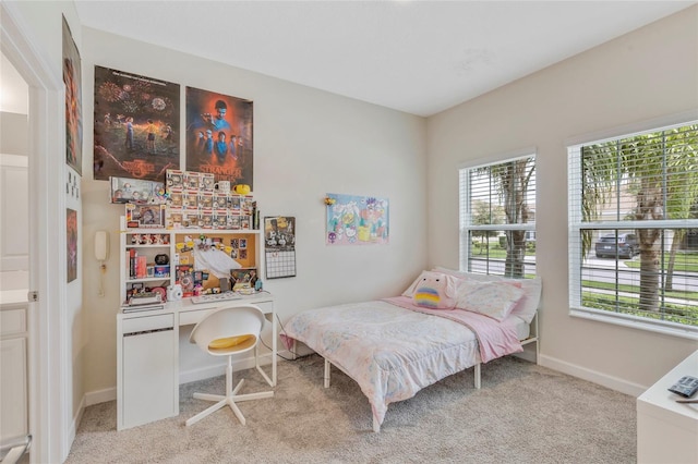 bedroom with light carpet