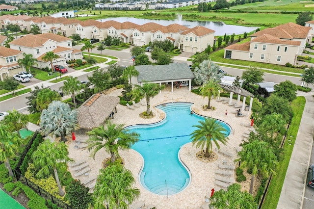 view of pool featuring a water view