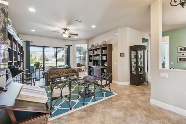 living room featuring ceiling fan and light tile patterned flooring