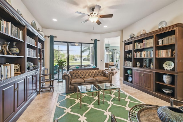 sitting room featuring ceiling fan and light tile patterned flooring