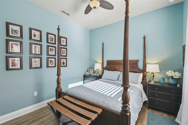 bedroom with ceiling fan and dark hardwood / wood-style flooring