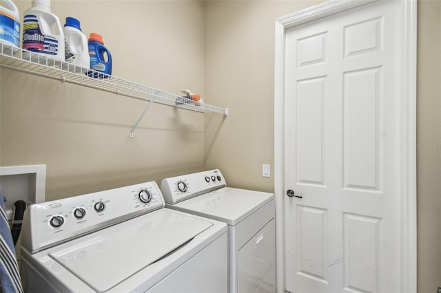 laundry area featuring washing machine and clothes dryer