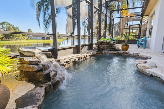 view of pool with pool water feature, a lanai, and a water view