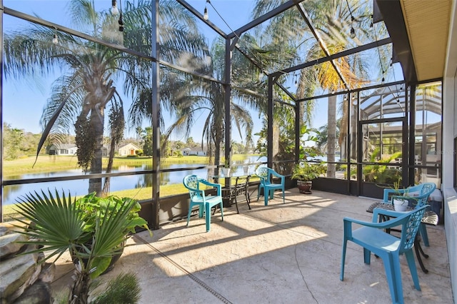 sunroom / solarium with a water view