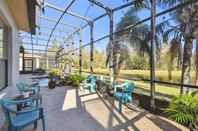 view of patio / terrace featuring glass enclosure