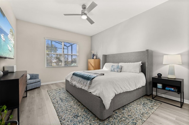 bedroom with ceiling fan and light hardwood / wood-style floors