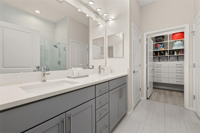 bathroom with vanity and walk in shower