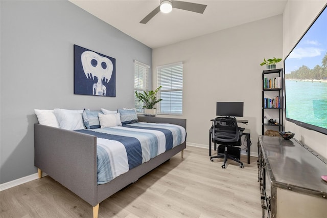 bedroom with light wood-type flooring and ceiling fan