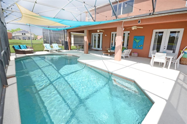 view of pool with french doors, a patio, and ceiling fan