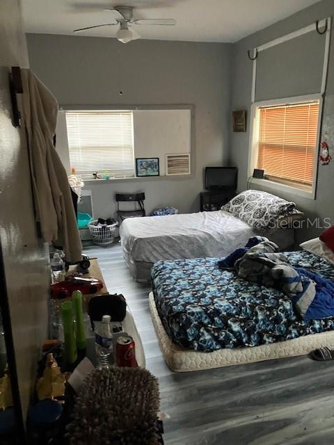 bedroom featuring ceiling fan and wood-type flooring