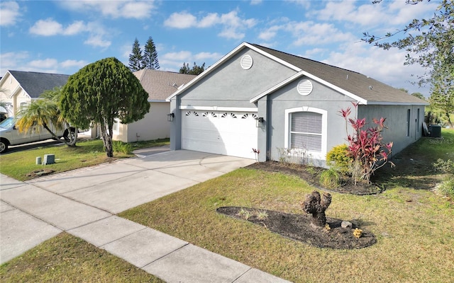 ranch-style house with a garage, central air condition unit, and a front lawn