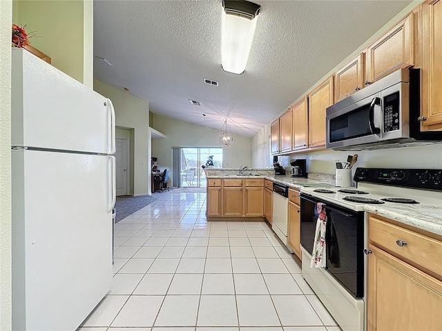 kitchen featuring kitchen peninsula, white appliances, a textured ceiling, light tile patterned floors, and lofted ceiling