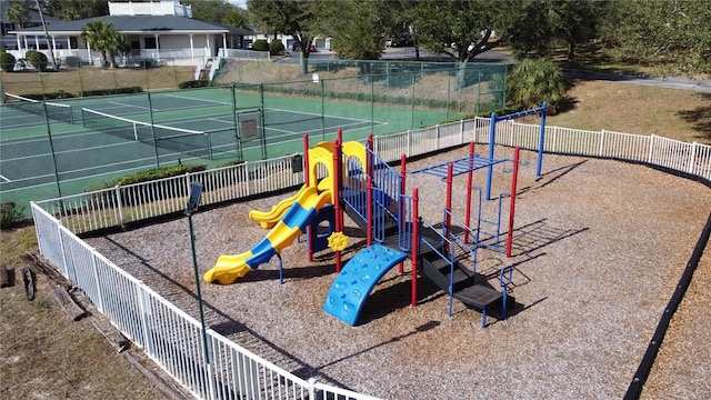 view of jungle gym with tennis court