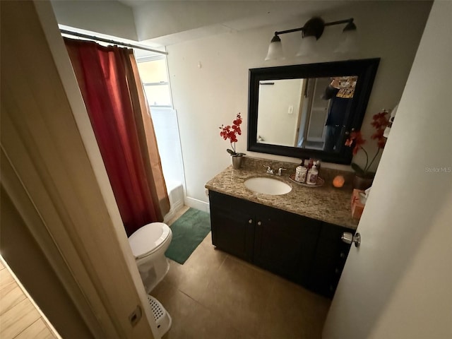 full bathroom featuring tile patterned floors, vanity, shower / tub combo, and toilet