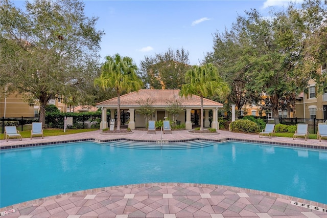 view of swimming pool featuring a patio area