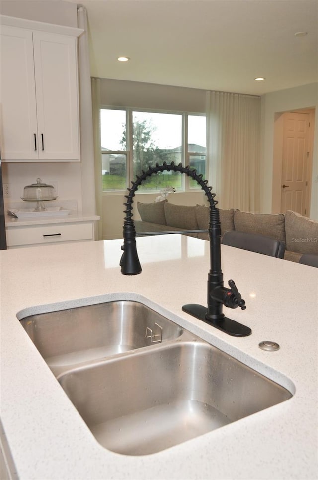 room details with sink and white cabinetry