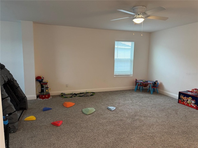 recreation room featuring ceiling fan and carpet