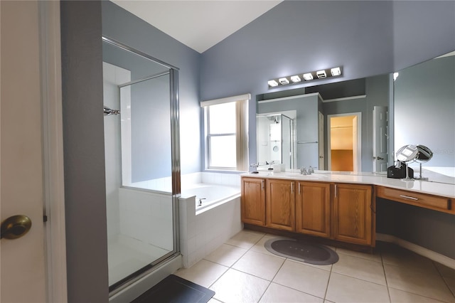 bathroom with tile patterned flooring, shower with separate bathtub, and vanity