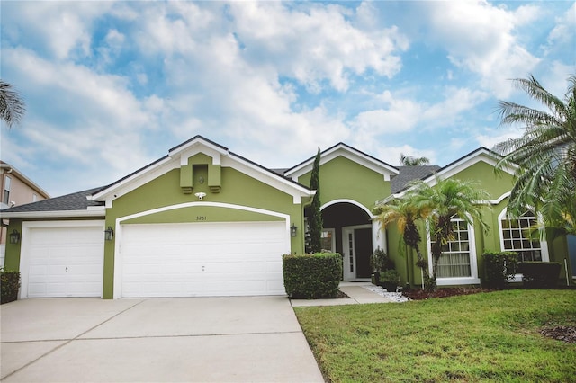 single story home featuring a front yard and a garage