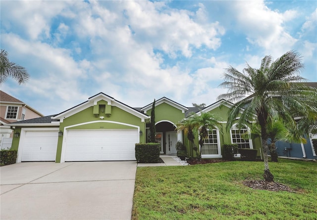 ranch-style house with a garage and a front lawn