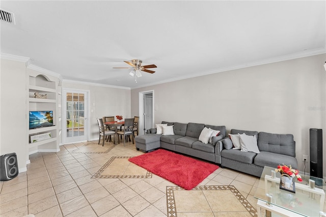 living room featuring built in shelves, light tile patterned flooring, ornamental molding, and ceiling fan