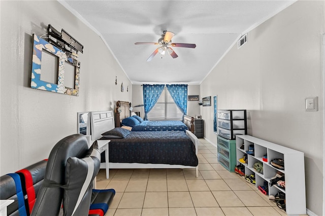 tiled bedroom with ceiling fan, crown molding, and vaulted ceiling