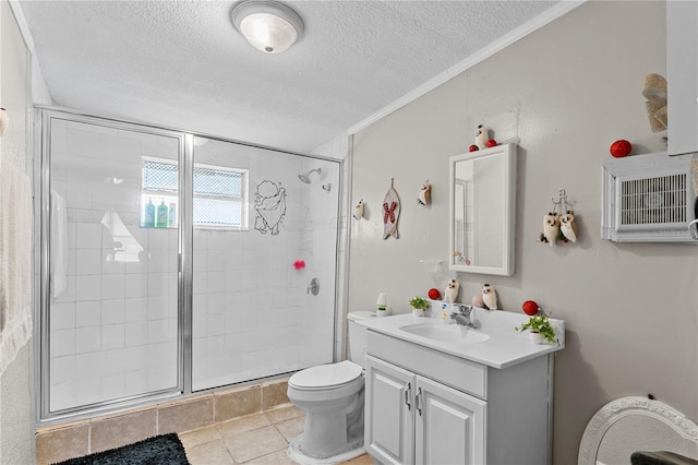 bathroom with vanity, a shower with door, crown molding, toilet, and a textured ceiling