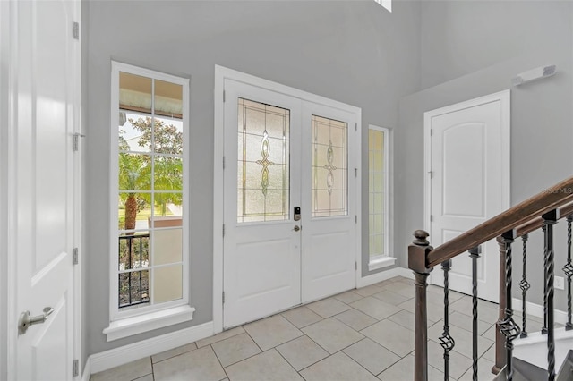 tiled foyer entrance featuring plenty of natural light