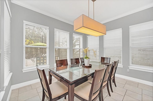 tiled dining space featuring crown molding