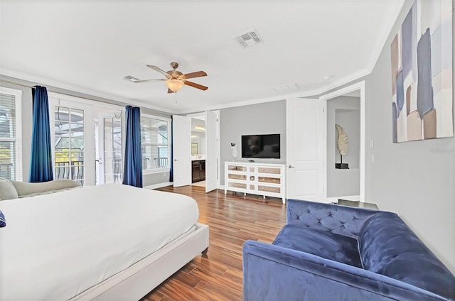 bedroom with dark wood-type flooring, connected bathroom, ornamental molding, access to outside, and ceiling fan