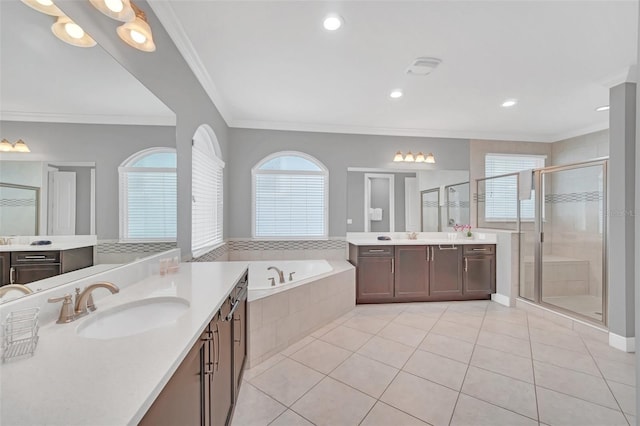 bathroom with separate shower and tub, tile patterned floors, a wealth of natural light, and ornamental molding