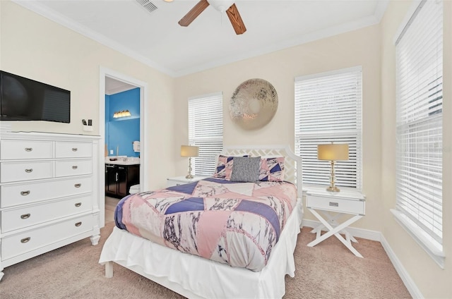 carpeted bedroom featuring ceiling fan, connected bathroom, and ornamental molding