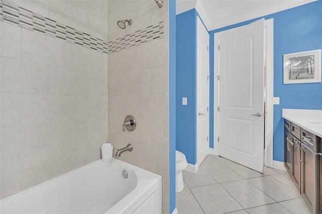 full bathroom with toilet, tiled shower / bath combo, tile patterned floors, and vanity