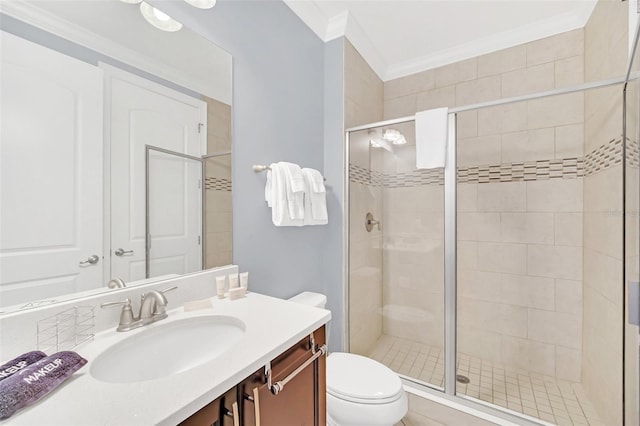 bathroom featuring toilet, crown molding, an enclosed shower, and vanity