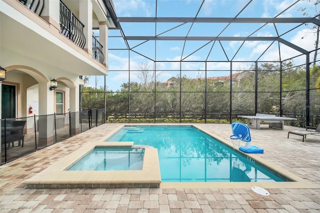 view of pool featuring an in ground hot tub, a lanai, and a patio