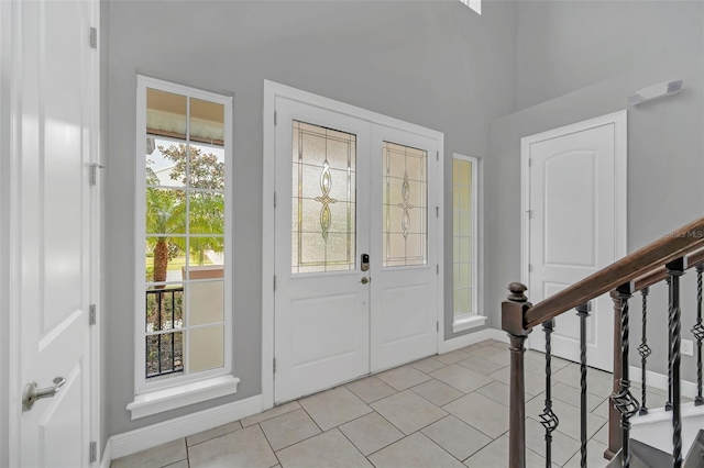 entryway featuring a wealth of natural light and light tile patterned floors