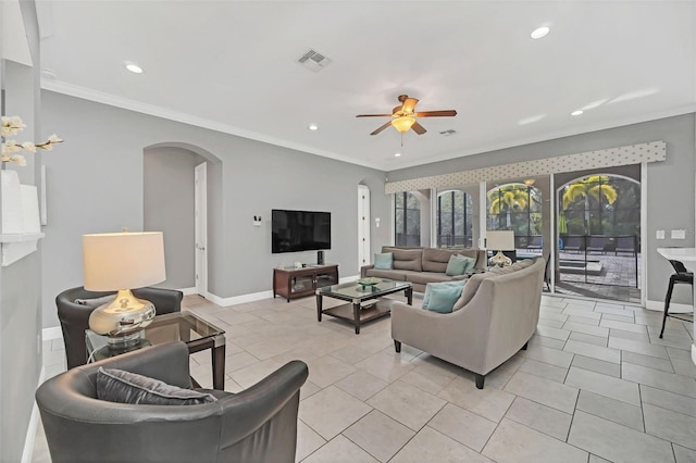 tiled living room with ornamental molding and ceiling fan