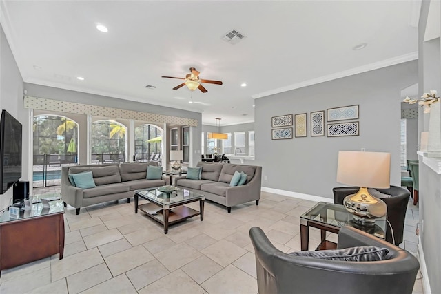 living room with ornamental molding, light tile patterned flooring, and ceiling fan