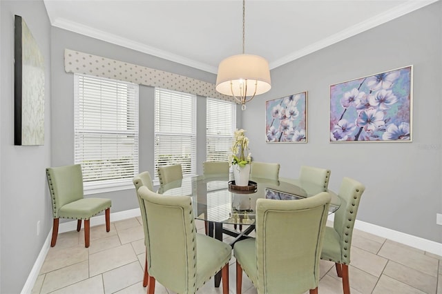 tiled dining area featuring ornamental molding and plenty of natural light