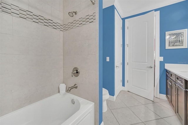 full bathroom with tiled shower / bath combo, vanity, tile patterned flooring, and toilet