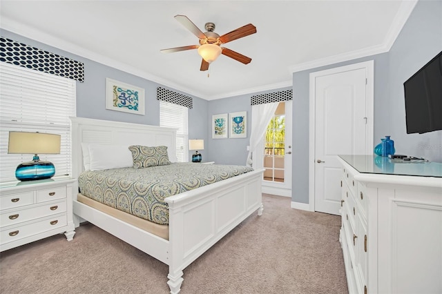 bedroom with crown molding, light carpet, and ceiling fan