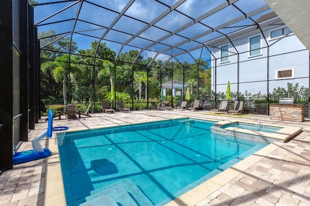 view of pool featuring an in ground hot tub, a lanai, and a patio area